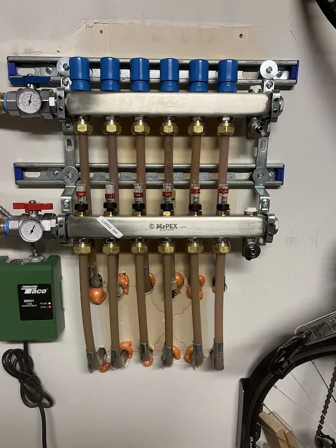 Plumber performing Water Heater Repair at a residential property in Solebury